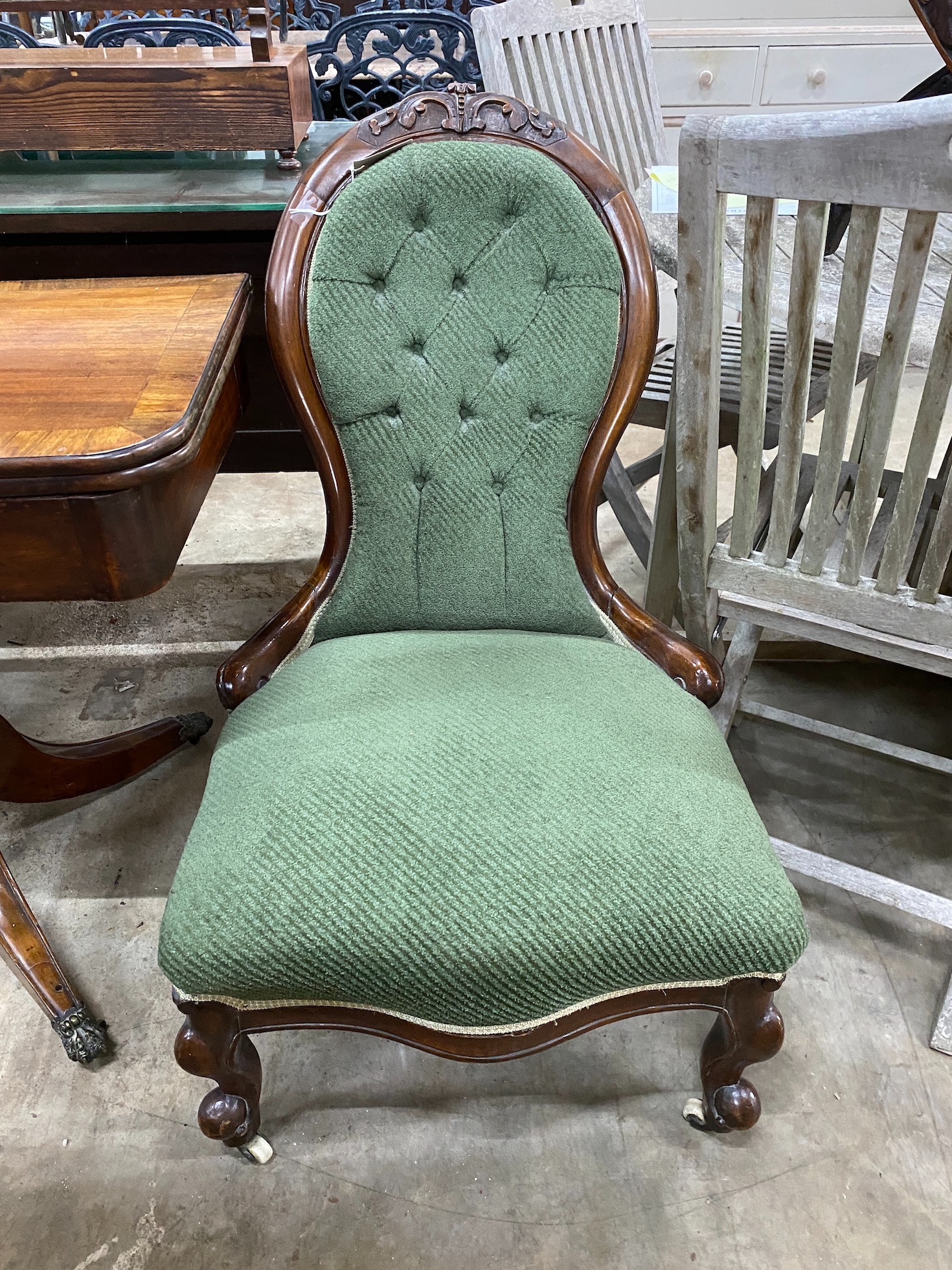A Victorian mahogany upholstered spoon back nursing chair, height 92cm